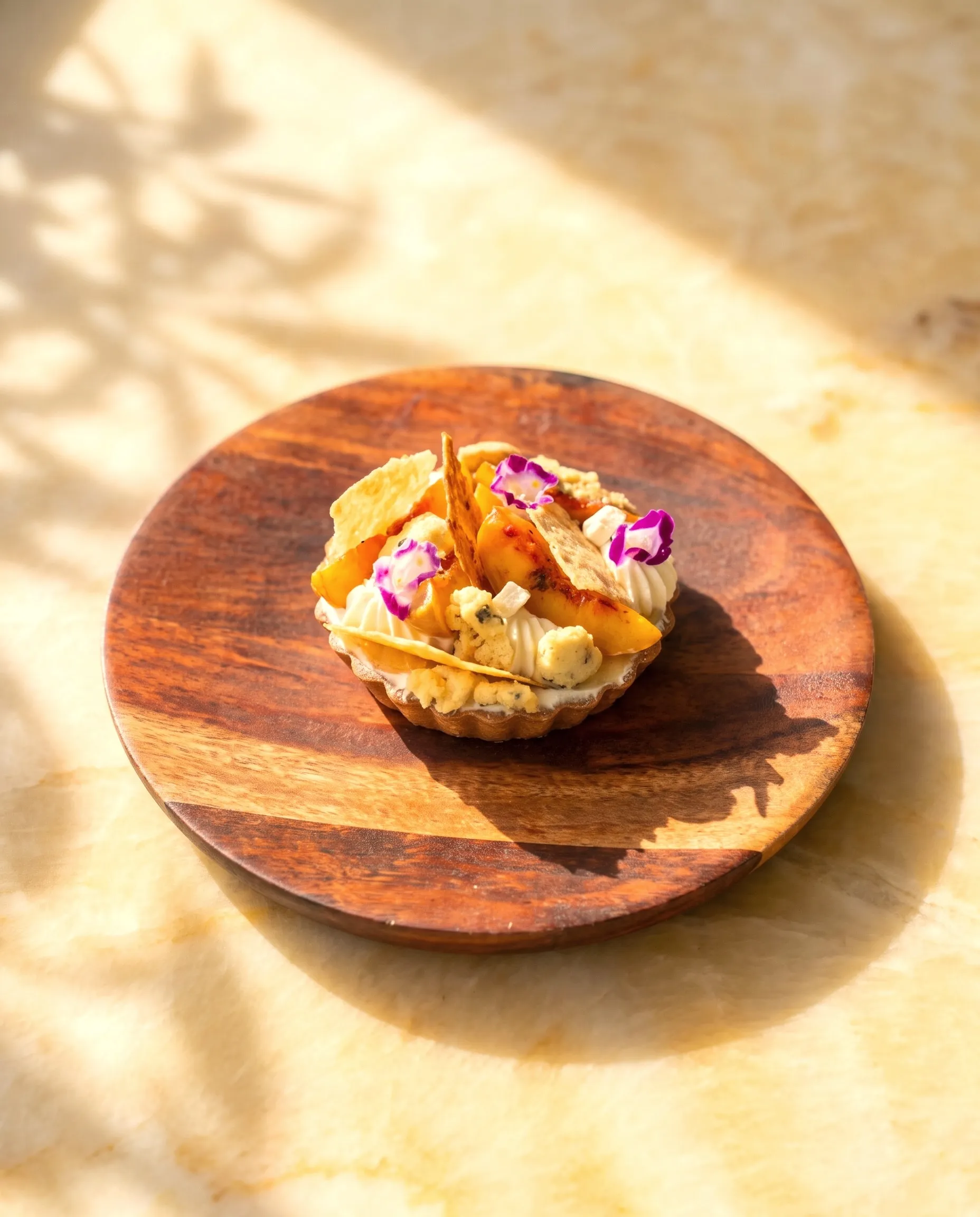 Fruit tartlet with edible flowers