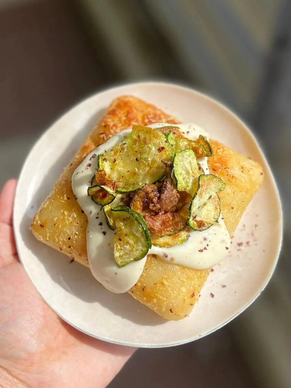 Savoury danish topped with crisp courgette and cream