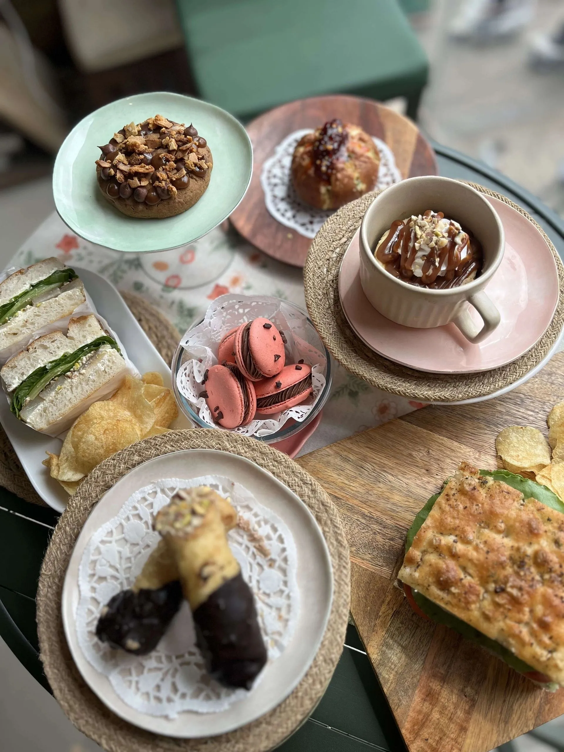 Table of Fiori Studio bakes: sandwiches, macarons, tarts and dessert cups